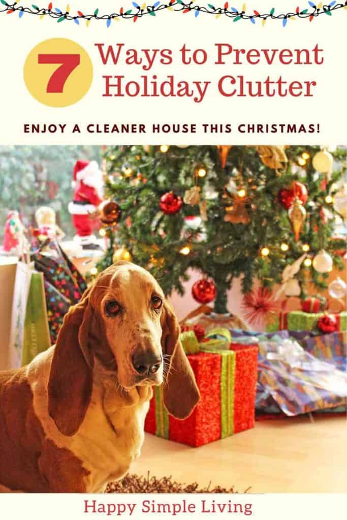 A basset hound sits in front of a Christmas tree surrounded by wrapped gifts. Text above reads, 7 Ways to Prevent Holiday Clutter and Enjoy a Cleaner House This Christmas! at the bottom is Happy Simple Living.